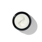 Texture of BL+ The Cream showing smooth white cream in open jar