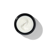 Texture of BL+ The Cream showing smooth white cream in open jar