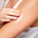 Model applying Body Oil to skin, lightweight oil that nourishes and enhances glow